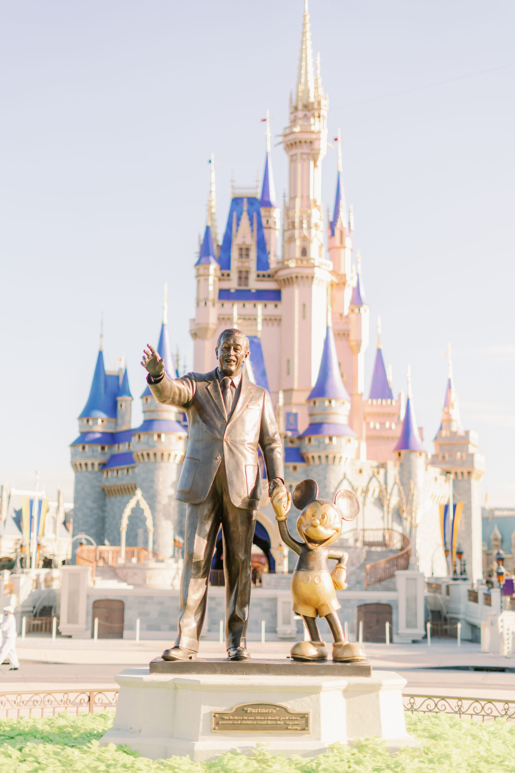 Walt and Mickey statue in front of Magic Kingdom castle